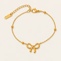 Vesviora Gold Bow Charm Bracelet